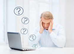 stressed old man filling a form at home