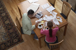 Couple sorting receipts